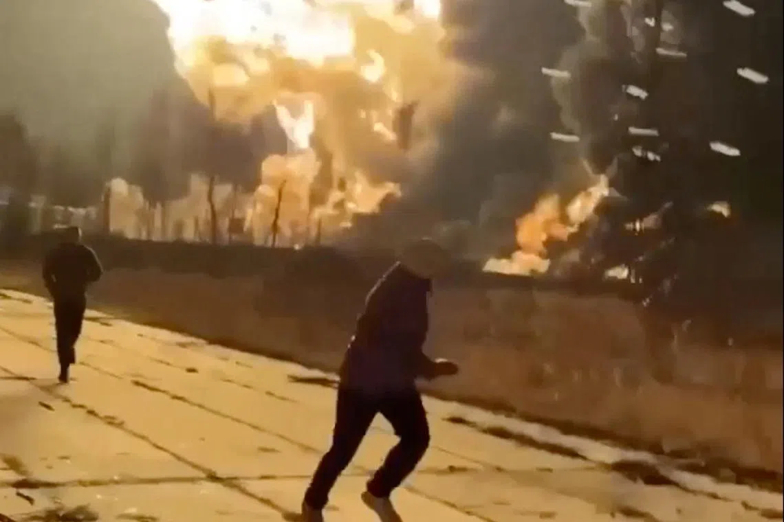People run as smoke rises from an explosion during what the governor of Russia's Ryazan region southeast of Moscow describes as an air attack, in Ryazan, Ryazan Region, Russia in this still image obtained from social media video released January 24, 2025. Social Media/via REUTERS