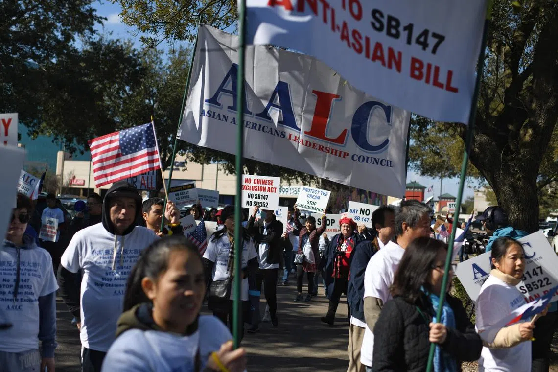 Demonstrators hold a protest against a bill that would forbid Chinese nationals from buying properties in Texas, on Feb 11. 