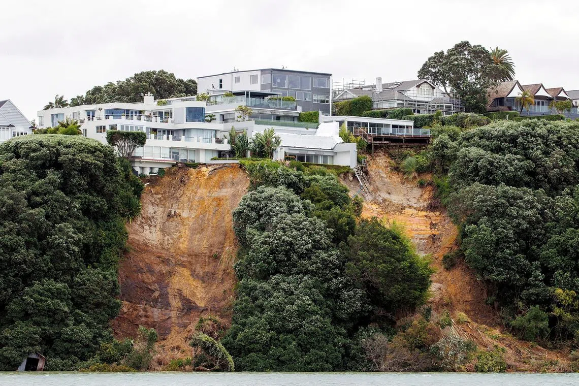 A landslide caused by continuous bad weather as Cyclone Gabrielle approaches in Auckland on Sunday.