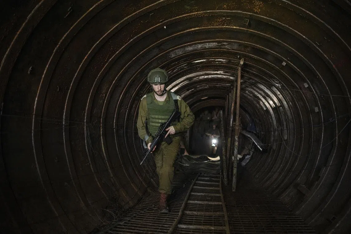 An Israeli soldier exits what Israel says is the largest Hamas tunnel they have discovered so far in Gaza, located a few hundred metres from the Erez border crossing.