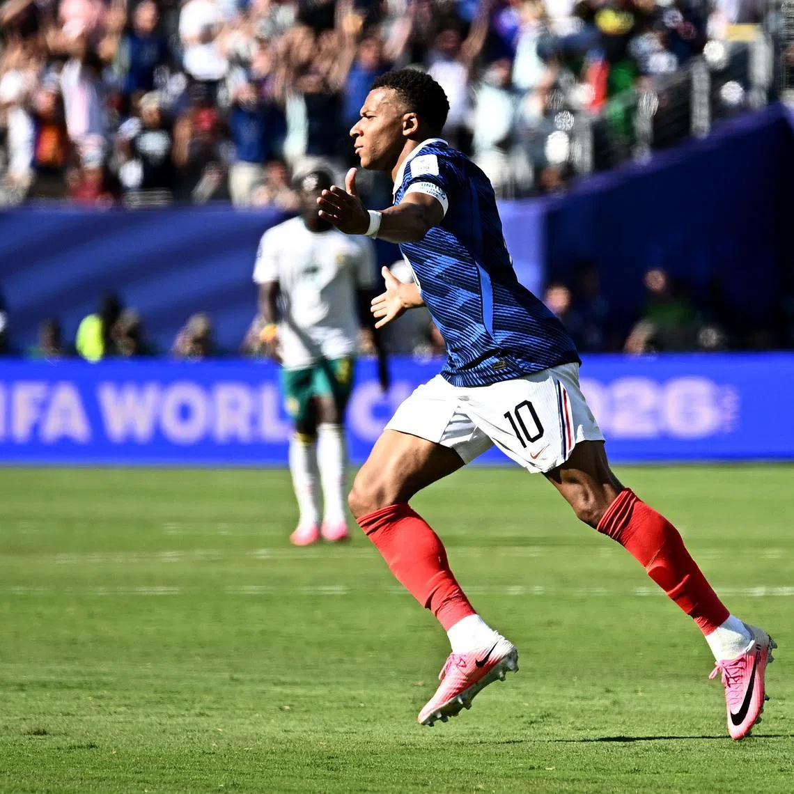 France's Kylian Mbappe celebrates scoring their third goal against Senegal on June 16. 