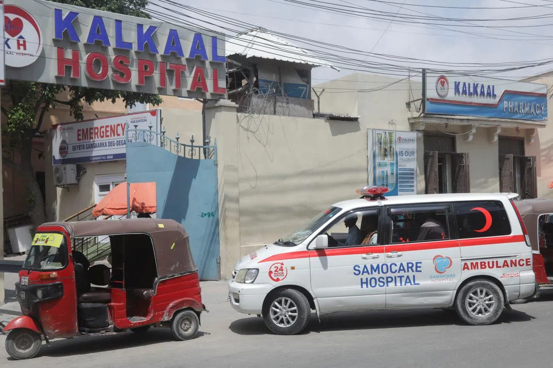 A Samocare ambulance carrying an unidentified wounded person drives into the Kalkaal hospital after Al-Qaeda-linked Al-Shabaab Islamist militants attacked the Villa Rose hotel in Mogadishu, Somalia, on Nov 28, 2022.
