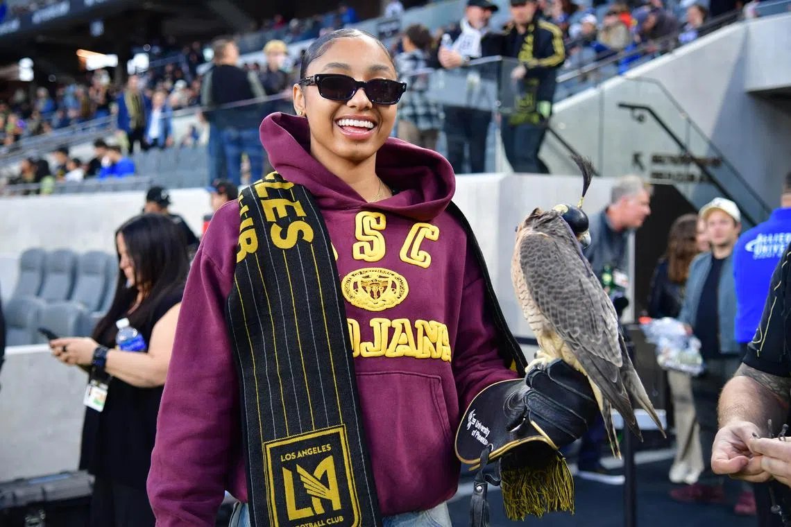 Apr 20, 2024; Los Angeles, California, USA; USC Trojans womens basketball guard JuJu Watkins smiles with the LAFC falcon before the game against the New York Red Bulls at BMO Stadium. Mandatory Credit: Gary A. Vasquez-USA TODAY Sports/ File Photo