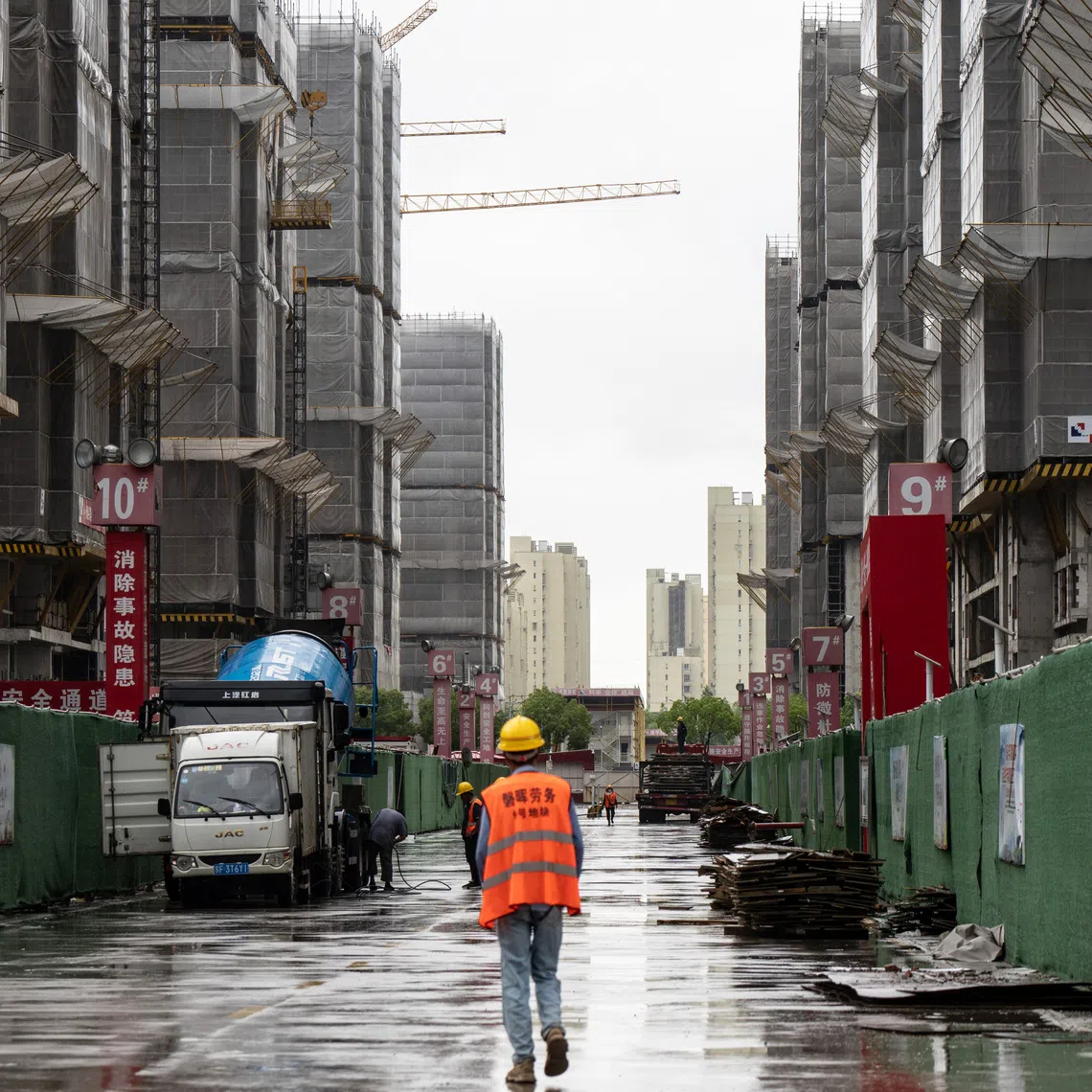 A residential complex development under construction in Shanghai in July. China is escalating a push to control the narrative around the moribund property market.