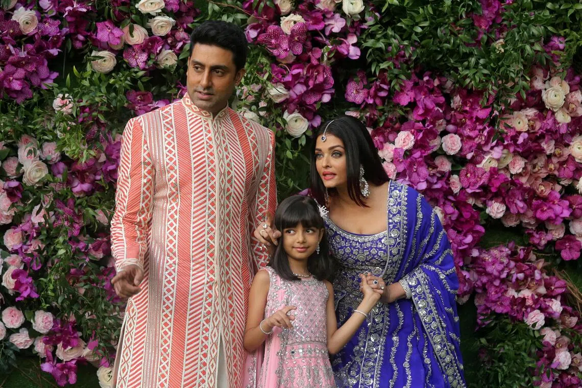 Abhishek Bachcha and his wife wife Aishwarya Rai and their daughter Aaradhya pose during a photo opportunity at the wedding ceremony of Akash Ambani, son of the Chairman of Reliance Industries Mukesh Ambani, at Bandra-Kurla Complex in Mumbai, India, March 9, 2019. REUTERS/Francis Mascarenhas/File Photo