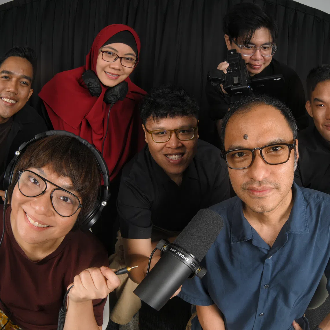 ST's podcast team (front row from left), Assistant podcast editor Lynda Hong and podcast editor Ernest Luis; (back from left) Podcast producers Amirul Karim, Fa'izah Sani, Hadyu Rahim, Eden Soh and Teo Tong Kai.