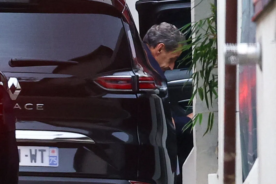 Former French President Nicolas Sarkozy arriving at his house, after a court ruled he should not serve his prison sentence pending his appeal against a conviction for criminal conspiracy, in Paris on Nov 10.