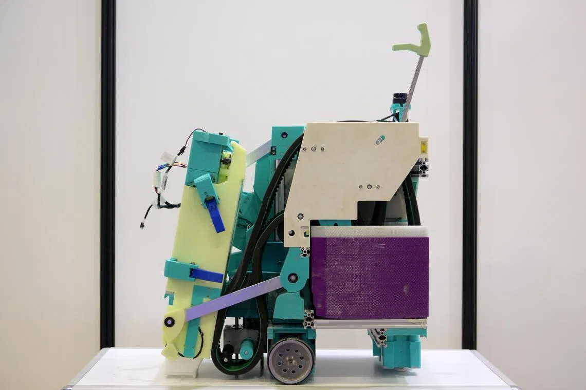 A tile grouting robot on display at a trade fair in 2023.