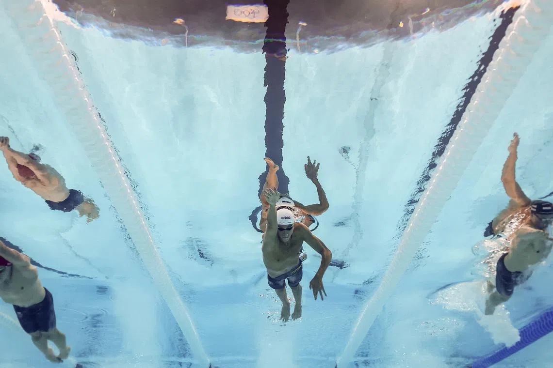 Paris 2024 Olympics - Swimming - Men's 200m Freestyle Final - Paris La Defense Arena, Nanterre, France - July 29, 2024.  David Popovici of Romania, Luke Hobson of United States and Duncan Scott of Great Britain in action. REUTERS/Marko Djurica