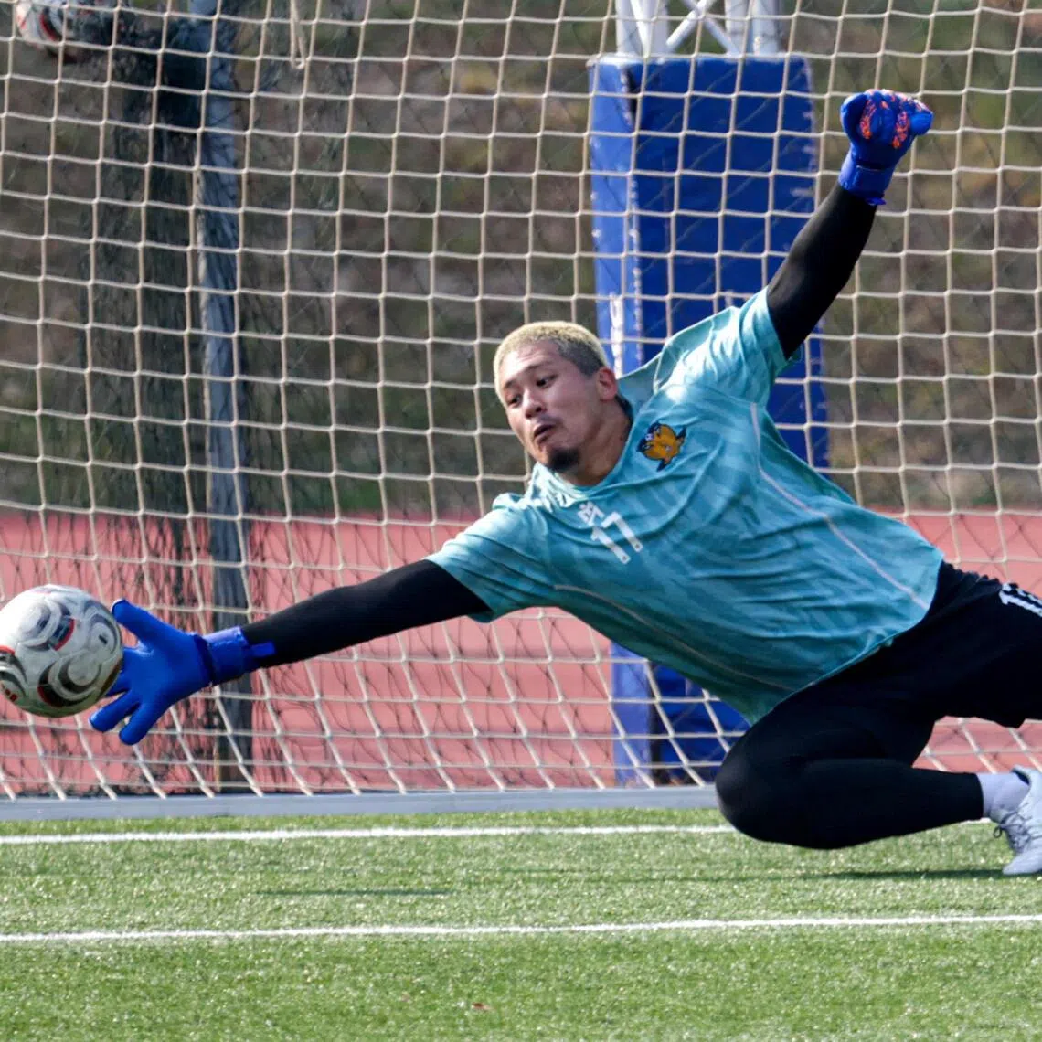 Hougang United’s new shot-stopper Takahiro Koga making a save during a training session at Bedok Stadium on Sep 3.
