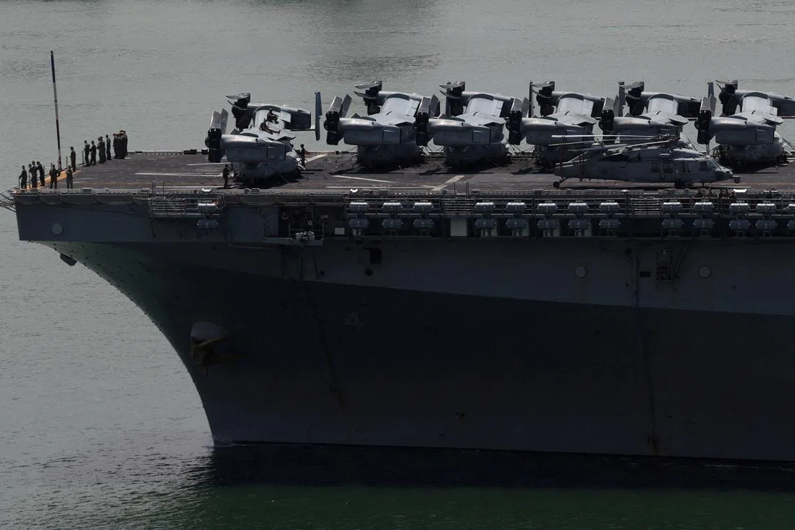 USS Boxer (LHD 4), a Wasp-class amphibious assault ship carrying MV-22B Osprey aircraft, entering the Johor Strait in northeastern Singapore on May 19, 2026. 