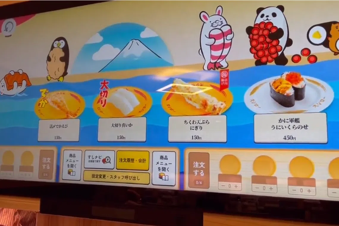 An actual conveyor belt is replaced by an ultrawide touchscreen that recreates the rotation of sushi on a virtual conveyor belt.