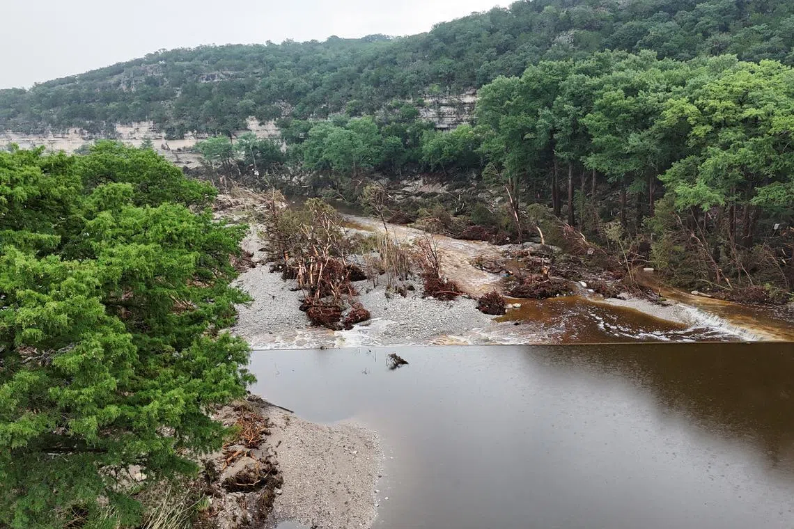 A drone view shows the Guadalupe River and damage from flooding near Camp Mystic, in Hunt, Texas, U.S. July 6, 2025. REUTERS/Evan Garcia