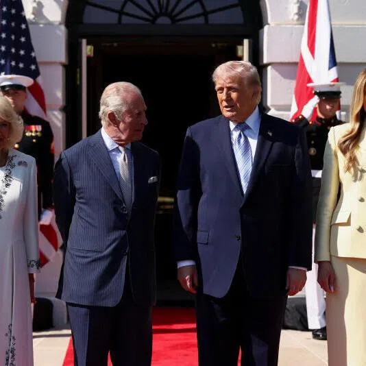 US President Donald Trump and first lady Melania Trump pose for a picture with Britain's King Charles and Queen Camilla at their arrival for afternoon tea on the South Lawn of the White House in Washington DC, on April 27.