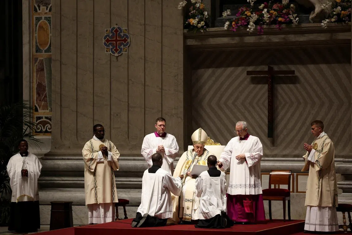 Pope Francis presides over the Easter Vigil in Saint Peter's Basilica at the Vatican, March 30, 2024. REUTERS/Yara Nardi