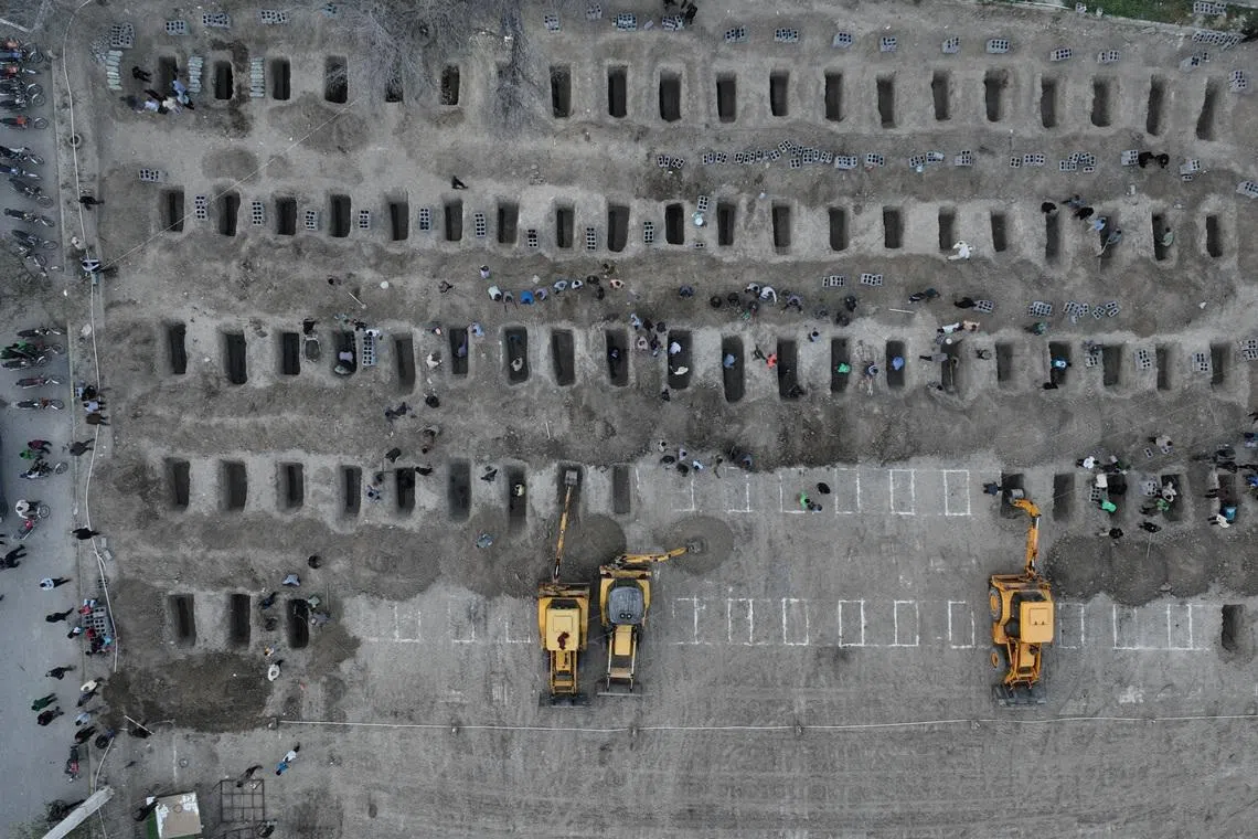 FILE PHOTO: Graves are being prepared for the victims following a reported strike on a school in Minab, Iran, March 2, 2026. Iranian Foreign Media Department/WANA (West Asia News Agency)/Handout via REUTERS/File Photo