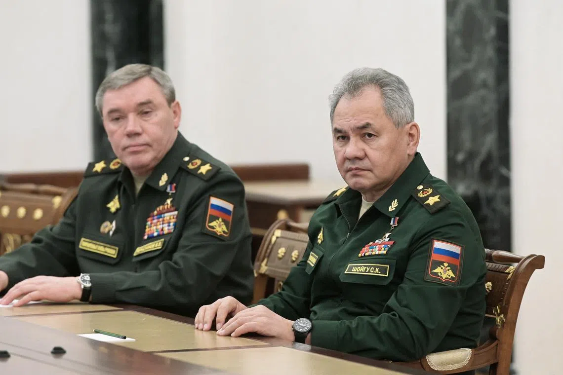 FILE PHOTO: Russian Defence Minister Sergei Shoigu and Chief of the General Staff of Russian Armed Forces Valery Gerasimov attend a meeting with Russian President Vladimir Putin in Moscow, Russia February 27, 2022. Sputnik/Aleksey Nikolskyi/Kremlin via REUTERS/File Photo