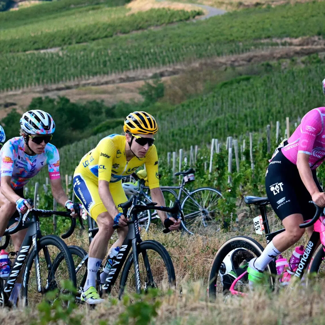 Defending champion Pauline Ferrand-Prevot (far left) navigating the hilly route from Macon to Belleville-en-Beaujolais on Aug 5.