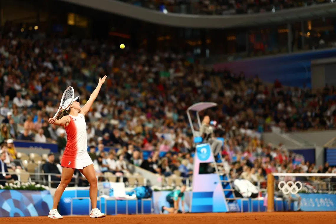 Iga Swiatek of Poland in action during her first round match against Irina-Camelia Begu of Romania at the Paris Games.