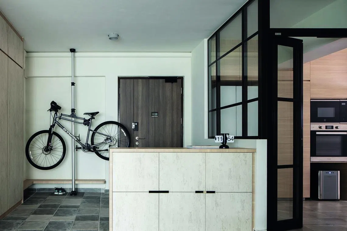 A bicycle rack for the couple, who are avid cyclists, and storage solutions complete the entryway. 