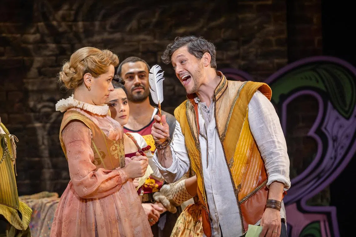 Cast members Amy Lehpamer (left, in foreground) and Rob Mills (right, in foreground) in the musical theatre production & Juliet.