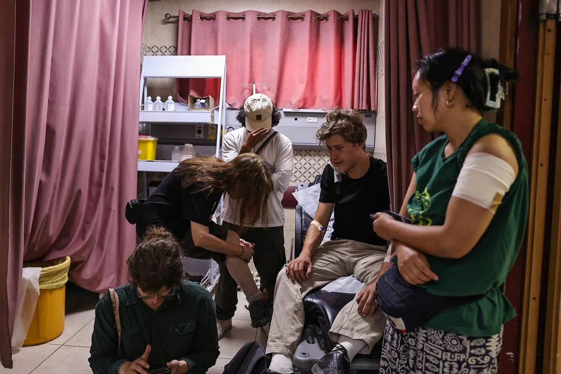 Eight mainly American volunteers were working with the farmers in an olive grove when settlers came after them.