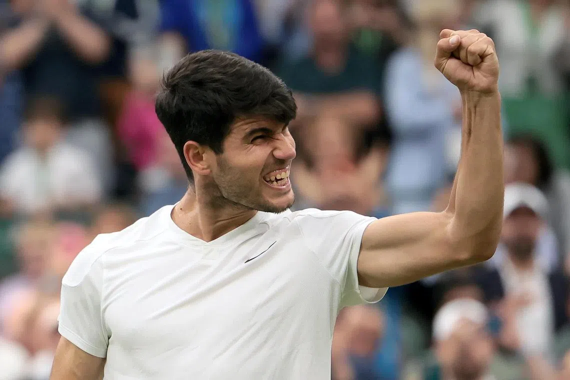 Defending champion Carlos Alcaraz celebrates after beating Tommy Paul, of the US, 5-7, 6-4, 6-2, 6-2.