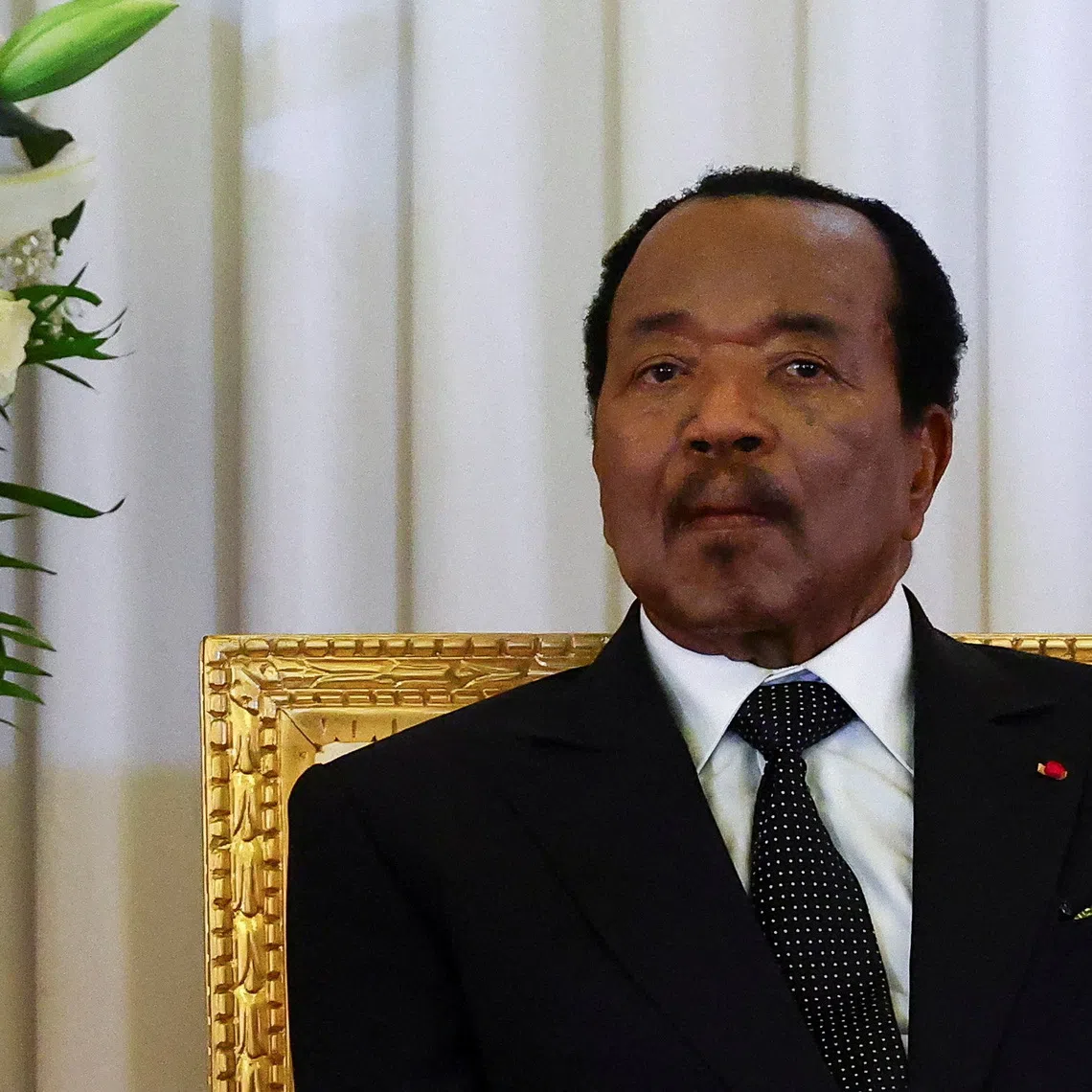 FILE PHOTO: Cameroonian President Paul Biya listens as Pope Leo XIV (not pictured) delivers a speech, at the Presidential Palace in Yaounde, during his apostolic journey to Cameroon, April 15, 2026. REUTERS/Guglielmo Mangiapane/File Photo