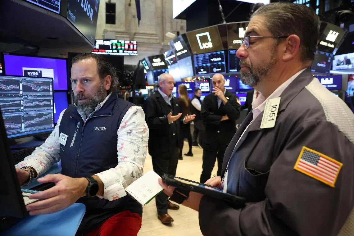 Traders working on the floor of the New York Stock Exchange, in New York City, on Dec 10.