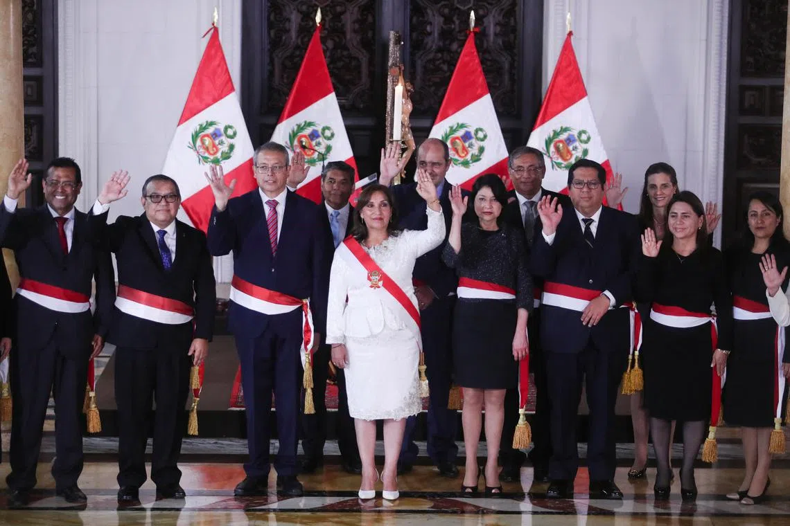Peru President Dina Boluarte poses for a family photo with members of her Cabinet, on Dec 10, 2022.