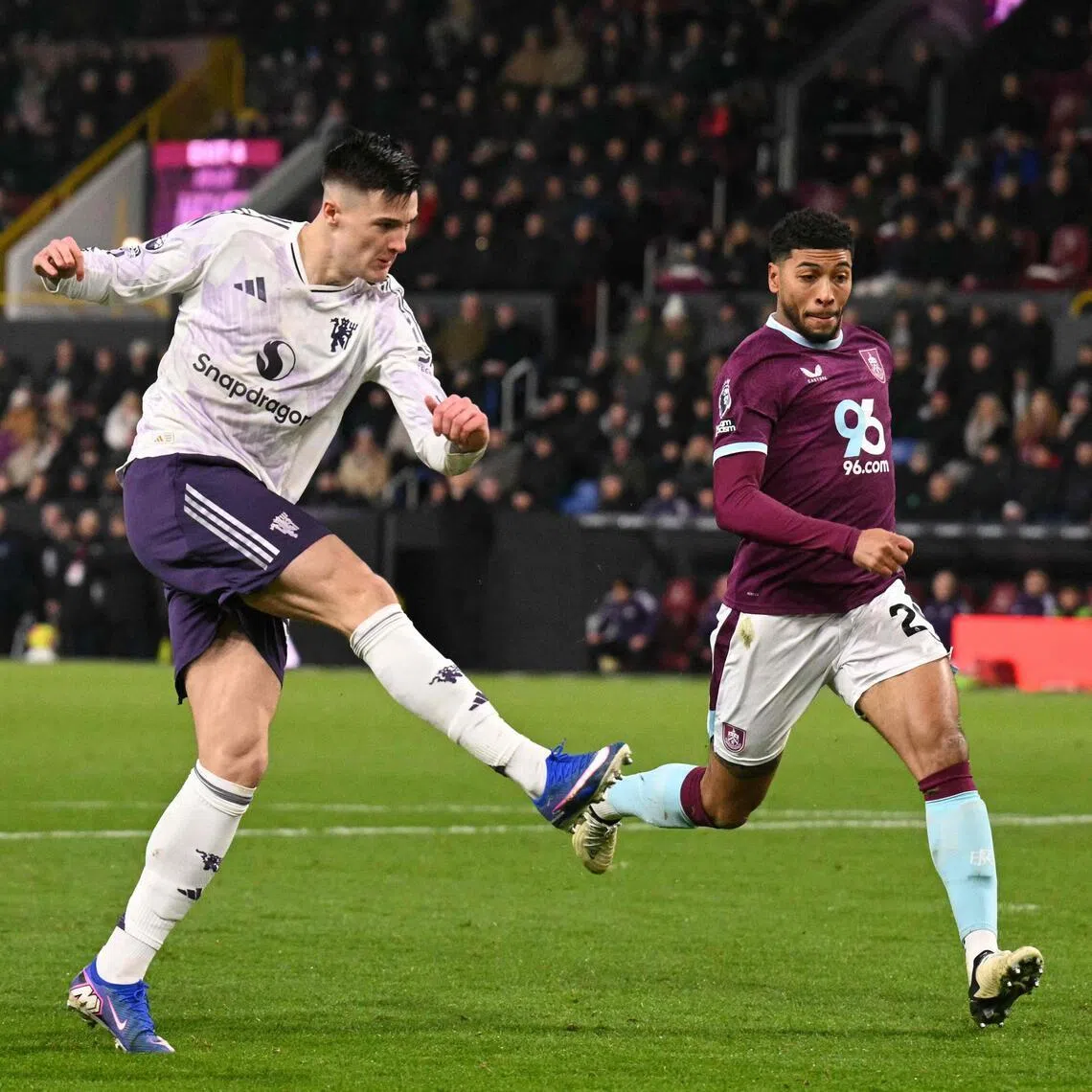 Manchester United's Slovenian striker Benjamin Sesko hammering the ball into the far corner to score the first of their two goals in a 2-2 English Premier League draw with Burnley at Turf Moor on Jan 7, 2026.