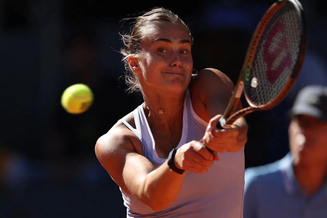 Belarus' Aryna Sabalenka returns the ball to Greece's Maria Sakkari during their singles semi-final match.