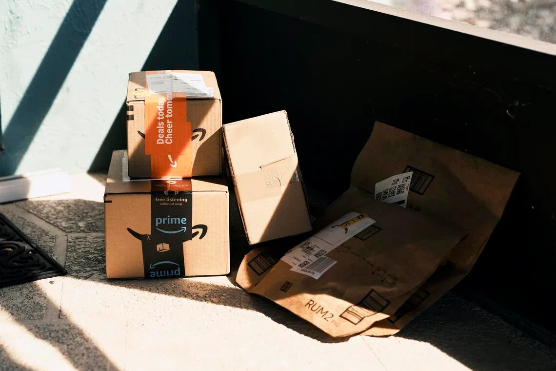 Newly-arrived packages from Amazon outside Kristen ContiÕs home in Englewood, Fla., on Nov. 21, 2025. Conti sought help after spending more than $1,000 on Labubu dolls and Christmas decorations. She has over $50,000 in credit card debt. (Zack Wittman/The New York Times)