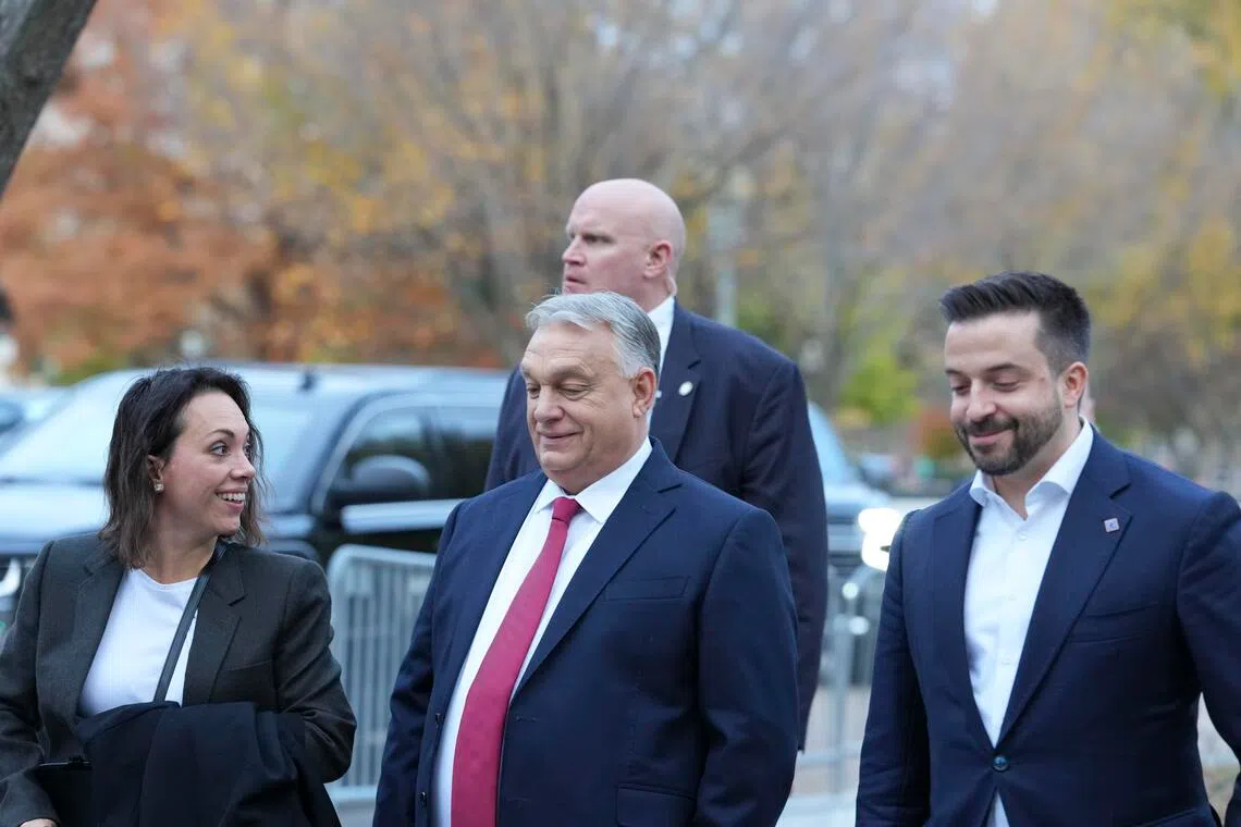 Prime Minister Viktor Orban of Hungary (centre) walking down Pennsylvania Avenue in Washington on Nov 7, after meeting US President Donald Trump at the White House.