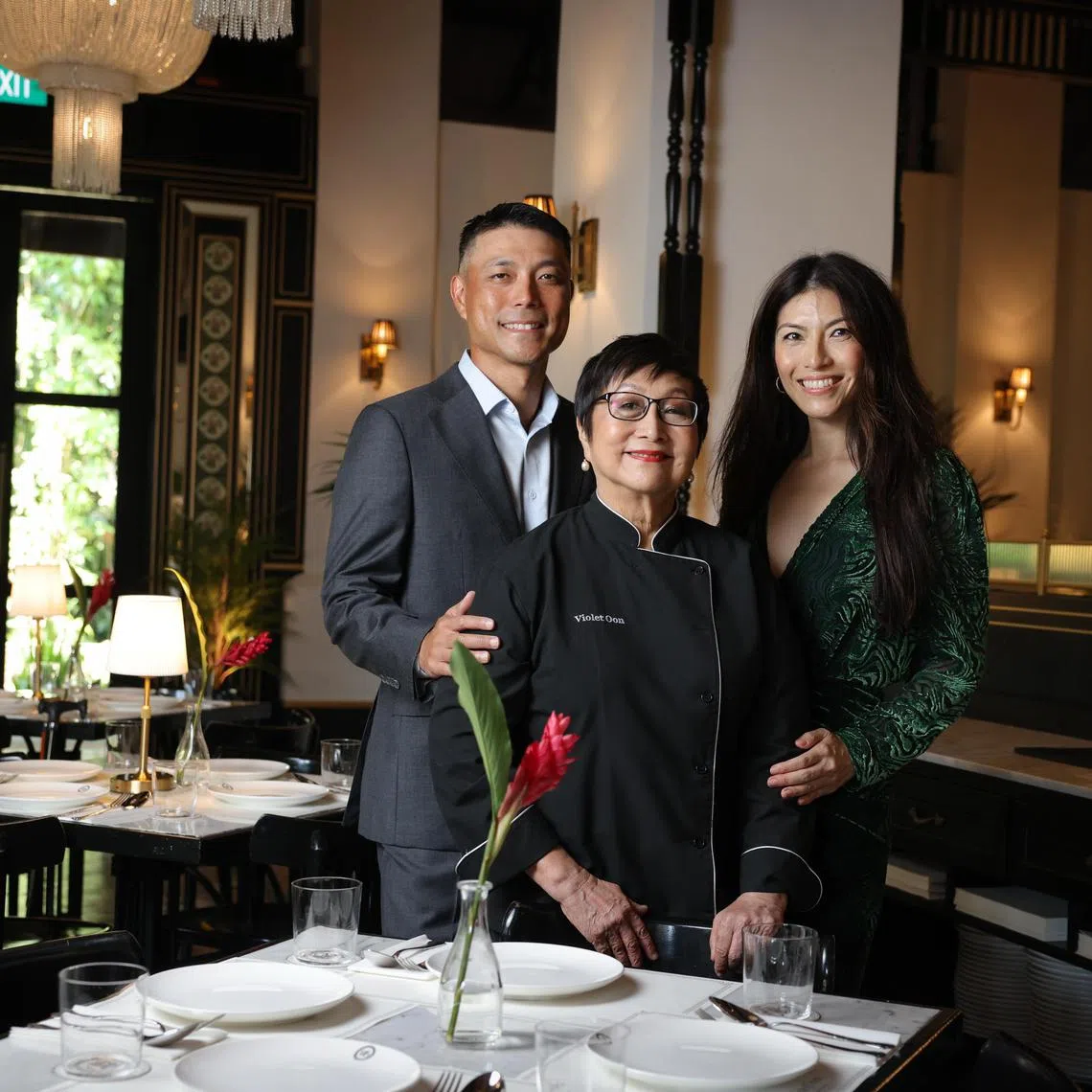 hyviolet12 ST20250410_202568400249 Ong Wee Jin / Tan Hsueh Yun / 

Violet Oon (centre) with her children Tay Yiming (left) and Tay Su-Lyn.

Feature on Violet Oon's new flagship restaurant at Dempsey.

Photographed on April 10, 2025.