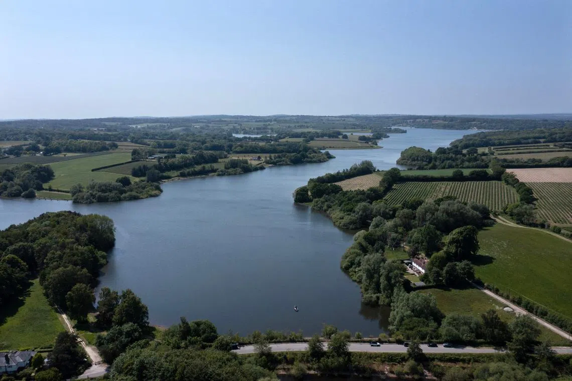 An aerial view shows Bewl Water reservoir near Lamberhurst, southern England on June 8, 2023, currently operating at 99 percent capacity of its 31,000 megalitres. (Photo by Ben STANSALL / AFP)