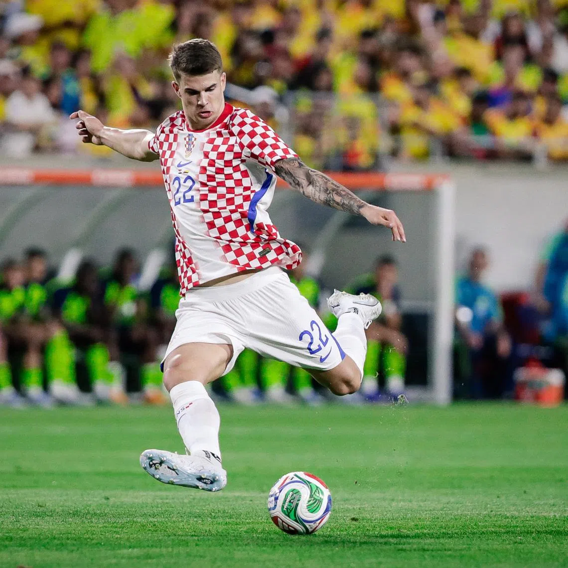 Mar 26, 2026; Orlando, Florida, USA; Croatia defender Luka Vuskovic (22) kicks the ball to score a goal against Colombia during the first half at Camping World Stadium. Mandatory Credit: Travis Register-Imagn Images