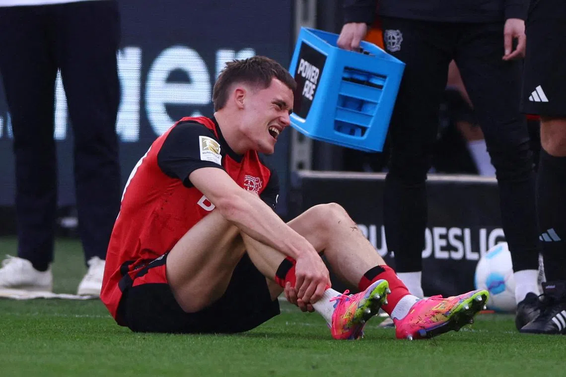 FILE PHOTO: Soccer Football - Bundesliga - Bayer Leverkusen v Werder Bremen - BayArena, Leverkusen, Germany - March 8, 2025 Bayer Leverkusen's Florian Wirtz reacts after sustaining an injury REUTERS/Thilo Schmuelgen/File Photo