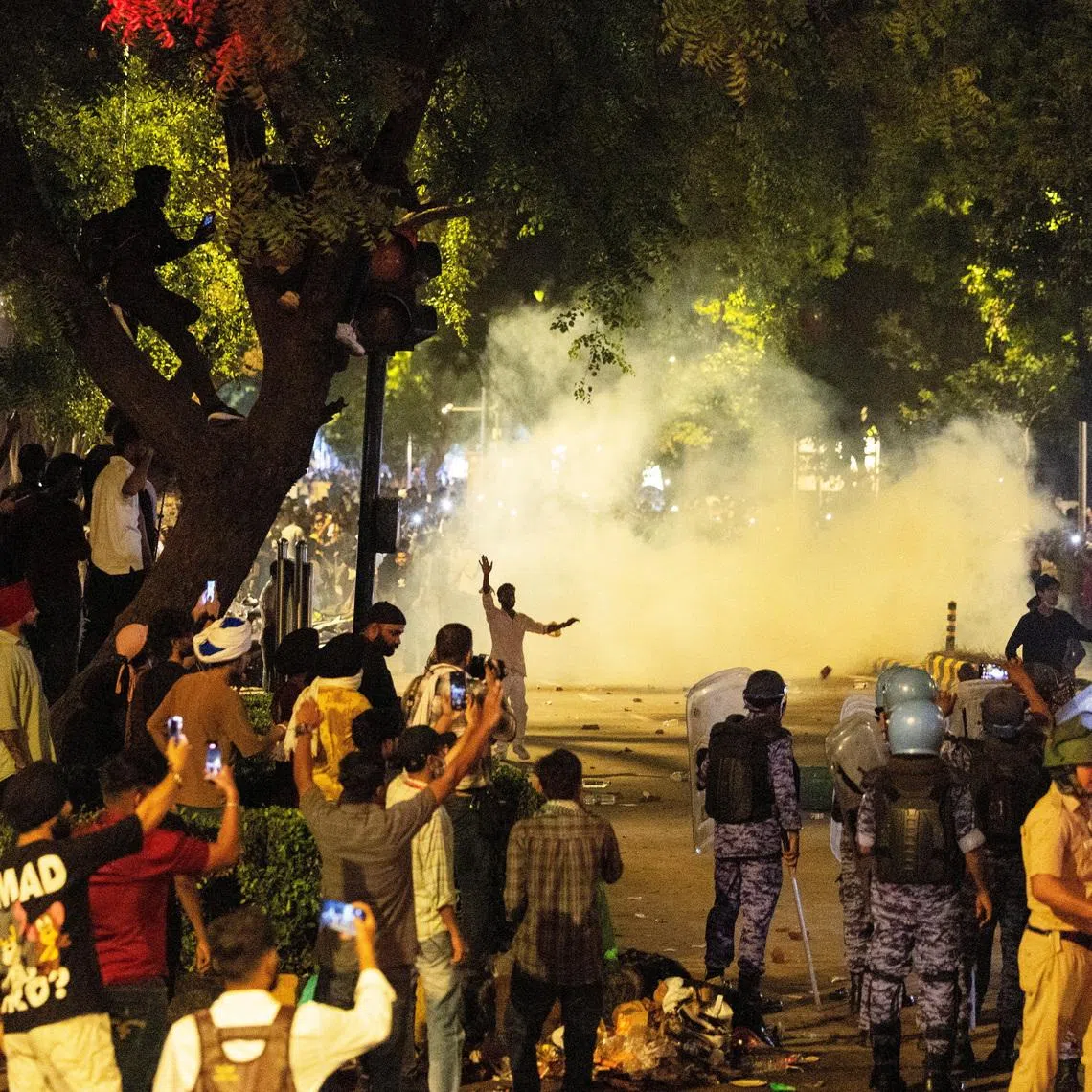 Police use teargas to control the crowd during a protest by students demanding the education minister’s resignation on July 22.