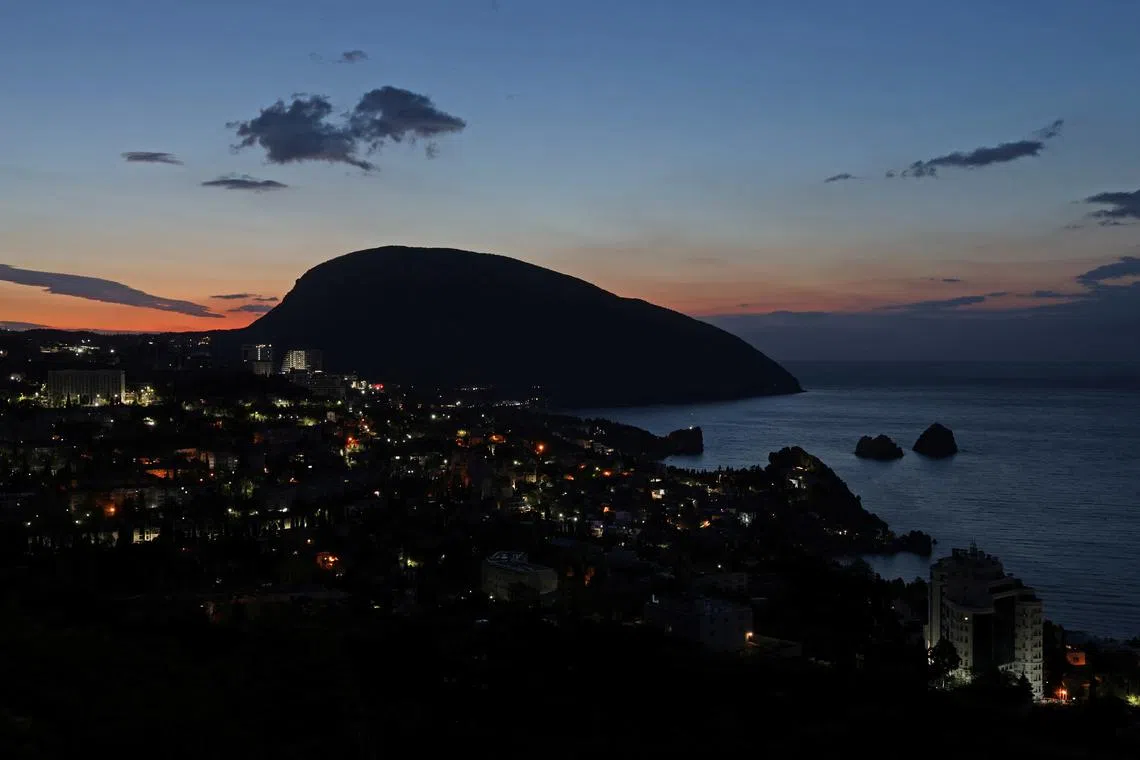 FILE PHOTO: A view shows the resort town of Gurzuf during sunrise, Crimea April 27, 2025. REUTERS/Alexey Pavlishak/File Photo