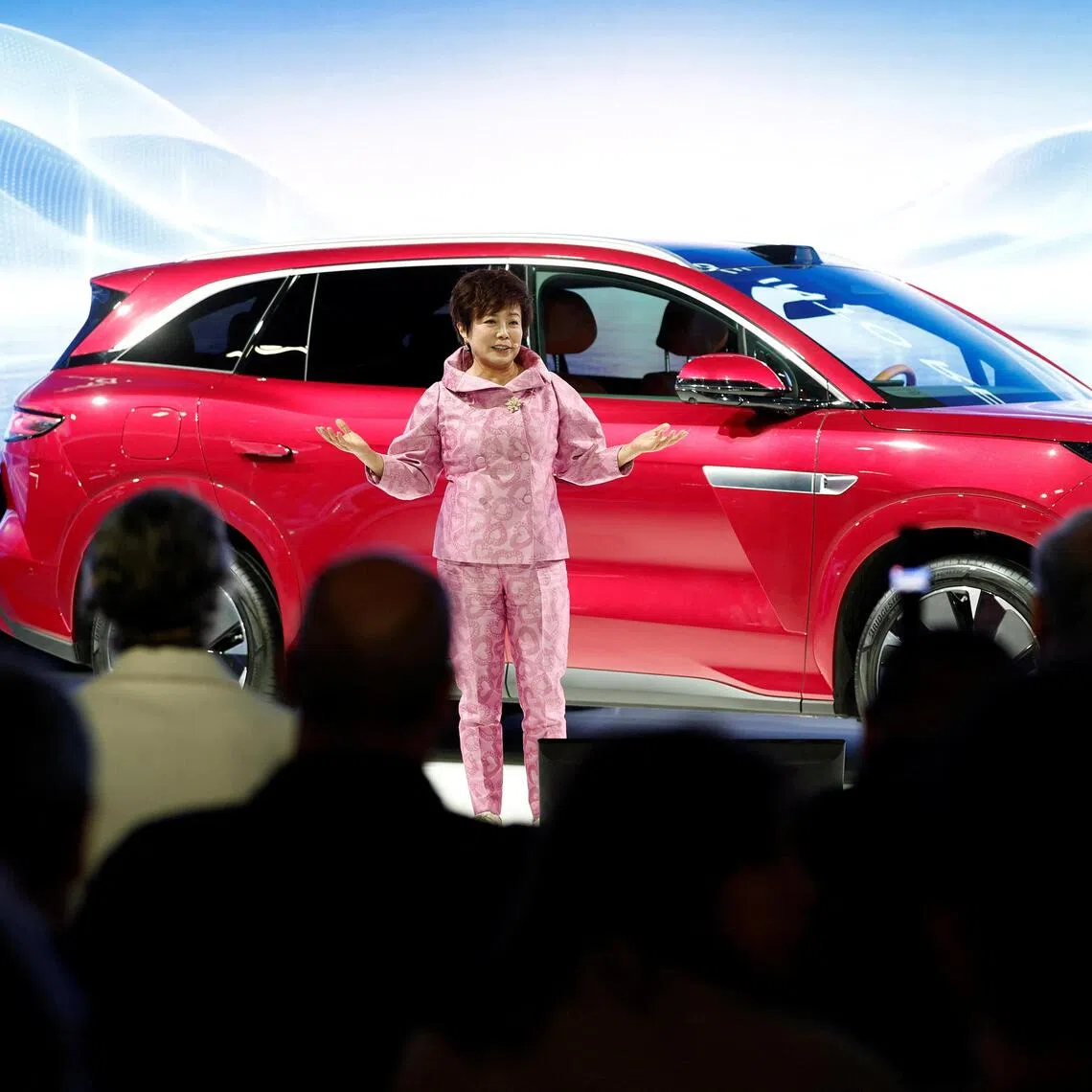 Stella Li, Executive Vice President of BYD, speaks during a press conference on media day at the 2026 Paris Auto Show in Paris, France, on Oct 12.