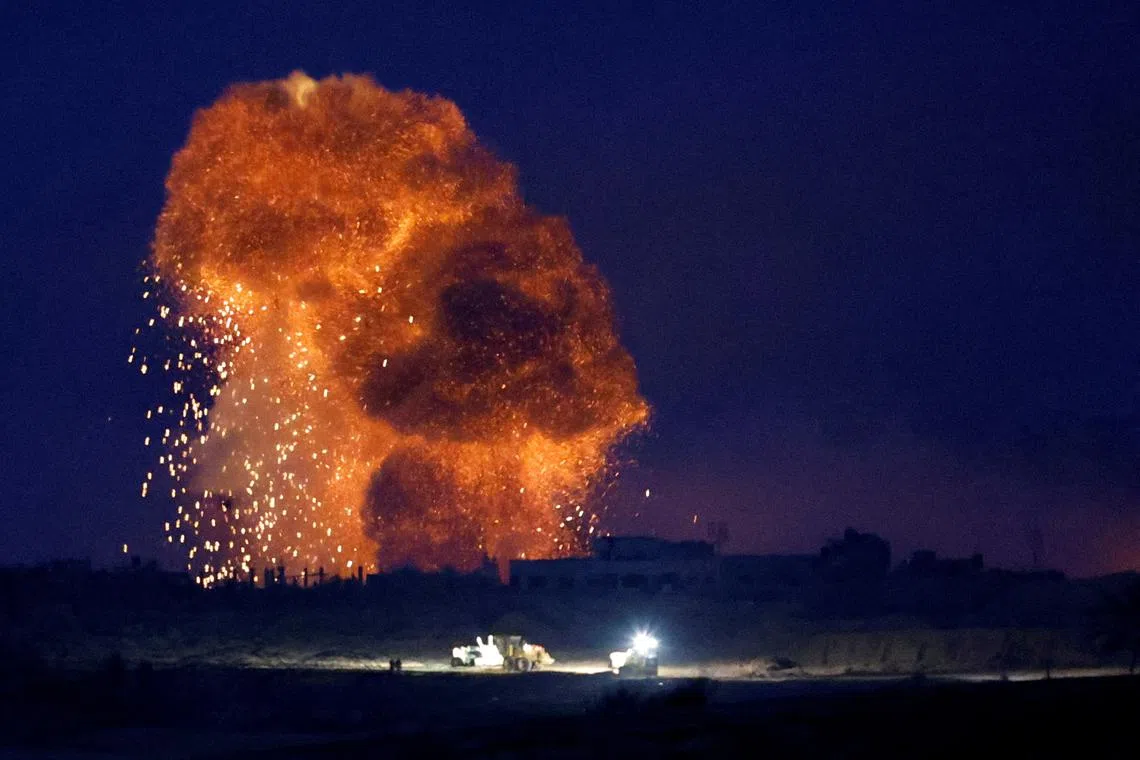An explosion during Israeli air strikes over Gaza, as seen from southern Israel, amid the ongoing conflict between Israel and the Palestinian group Hamas, Nov 22, 2023. 