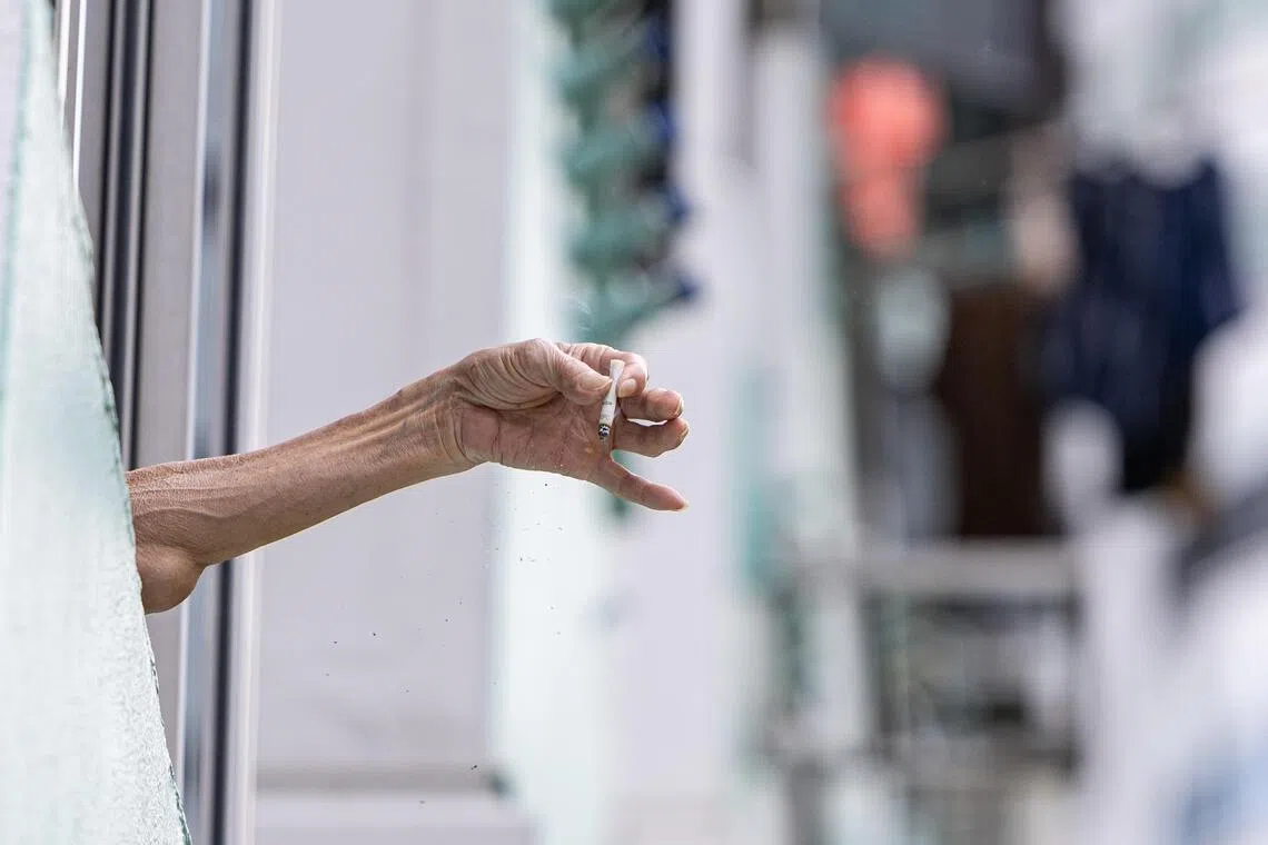 ST20250415_202573400574/pixgenerics/Brian Teo/Generic of a smoker at block 120 Lor 2 Toa Payoh on April 15, 2025. Can be used for stories on smoking, smoke-free Singapore, tobacco products, cigarettes, health issues, second-hand smoke. ST PHOTO: BRIAN TEO 