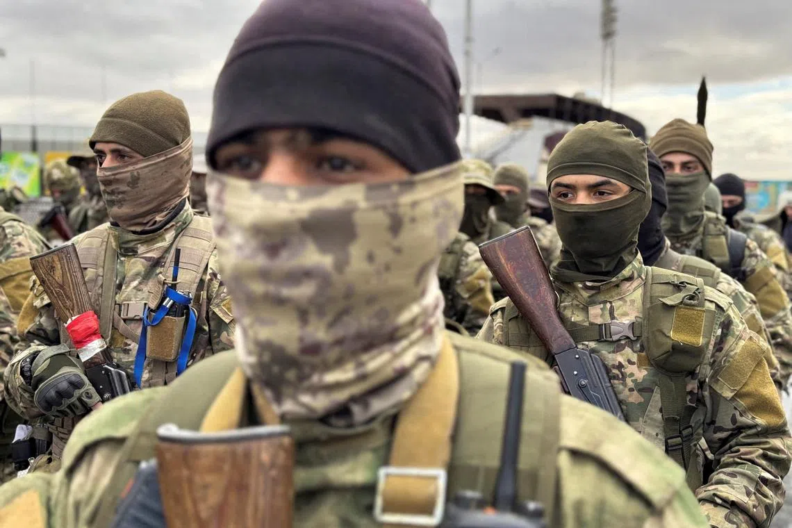 FILE PHOTO: Khaled Brigade, a part of Hay'at Tahrir al-Sham (HTS), hold a military parade, after Syria's Bashar al-Assad was ousted, in Damascus, Syria, December 27, 2024. REUTERS/Ahmed Jadallah/File Photo