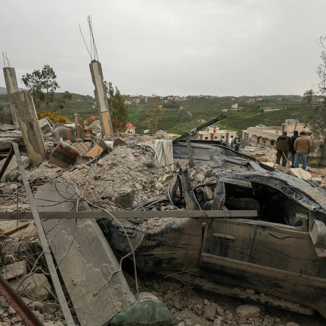 A destroyed car among the rubble of a house hit by an Israeli strike, amid escalating hostilities between Israel and Hezbollah, as the U.S.-Israel conflict with Iran continues, in Houmine El Tahta, Lebanon, April 1, 2026. REUTERS/Yara Nardi     TPX IMAGES OF THE DAY