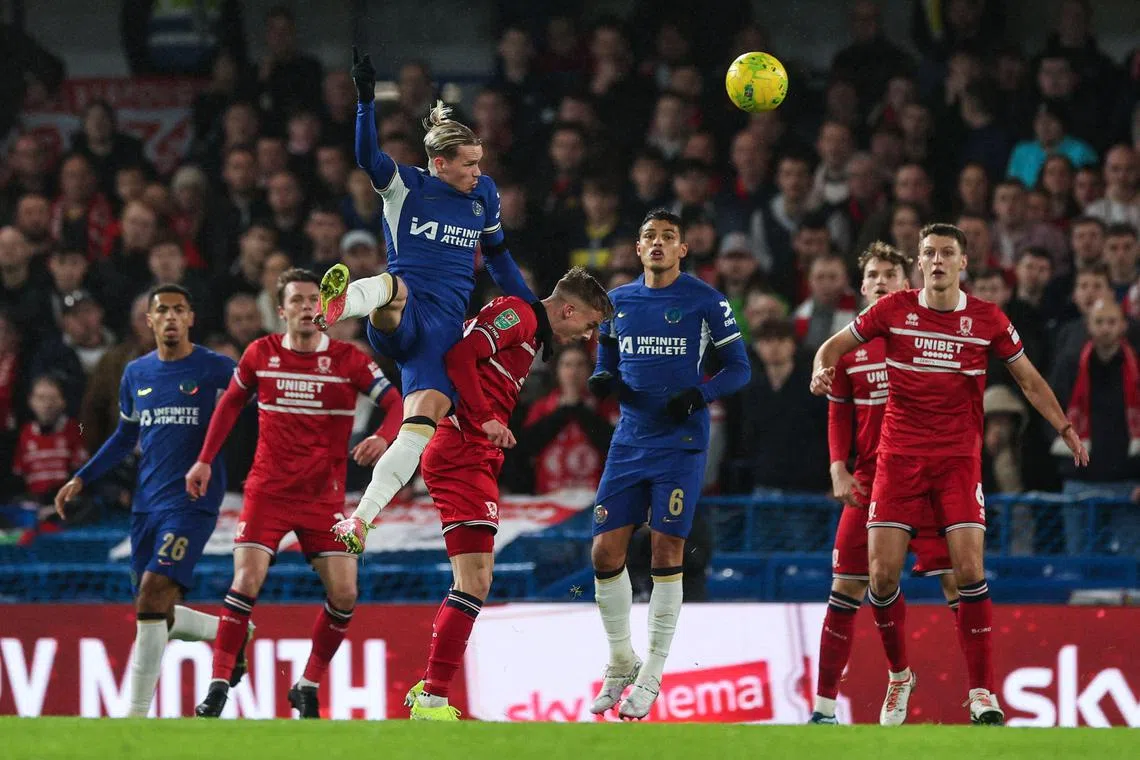 Chelsea's Mykhailo Mudryk heads the ball during the second leg of the League Cup semi-finals against Middlesbrough.