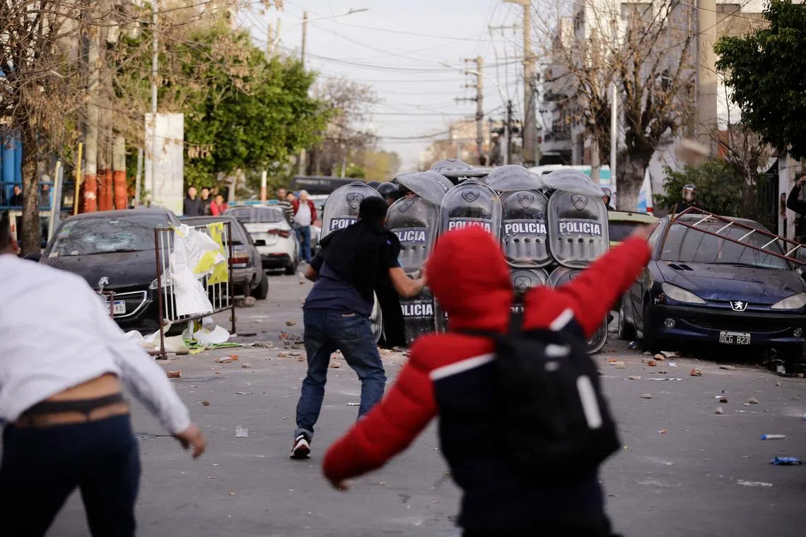 Protesters clash with police during a demonstration demanding justice for the 11-year-old girl in Lanus, Argentina, on Aug 9.