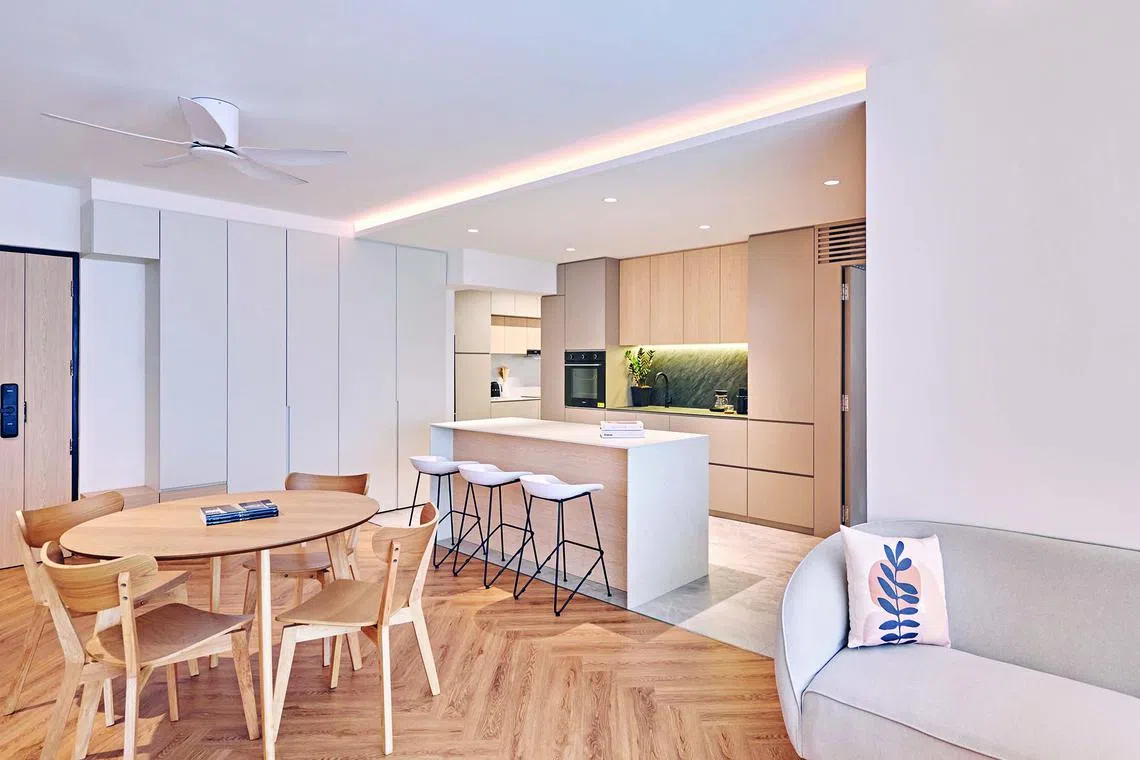 The living, dining and dry kitchen areas form one big open space that can accommodate large gatherings with various seating configurations.