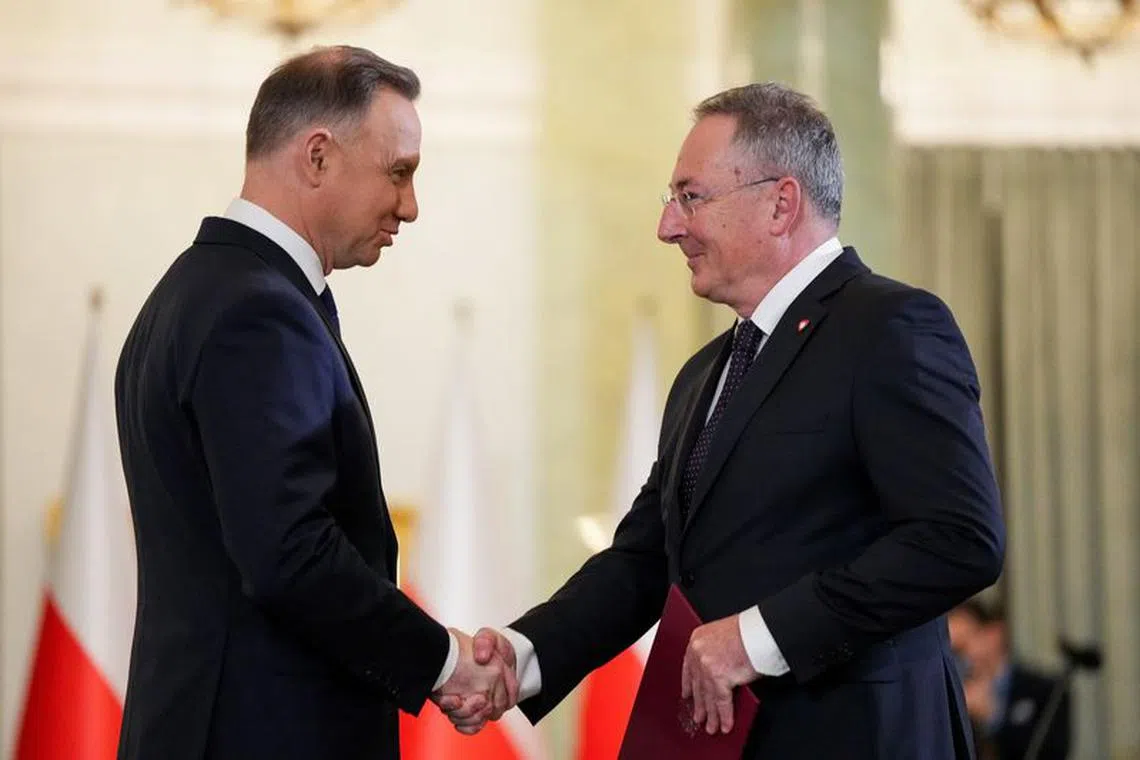 Polish President Andrzej Duda and newly appointed Polish Culture Minister Bartlomiej Sienkiewicz attend the cabinet swearing-in ceremony at the Presidential Palace in Warsaw, Poland December 13, 2023. REUTERS/Aleksandra Szmigiel/File Photo