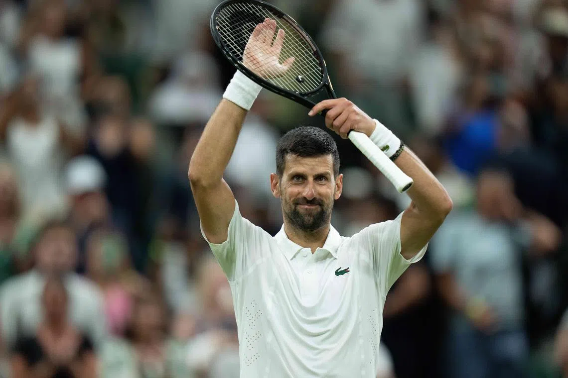 Jul 1, 2026; London, United Kingdom; Novak Djokovic of Serbia celebrates winning his match against Stefanos Tsitsipas of Greece on day three at All England Lawn Tennis and Croquet Club.  Mandatory Credit: Susan Mullane-Imagn Images